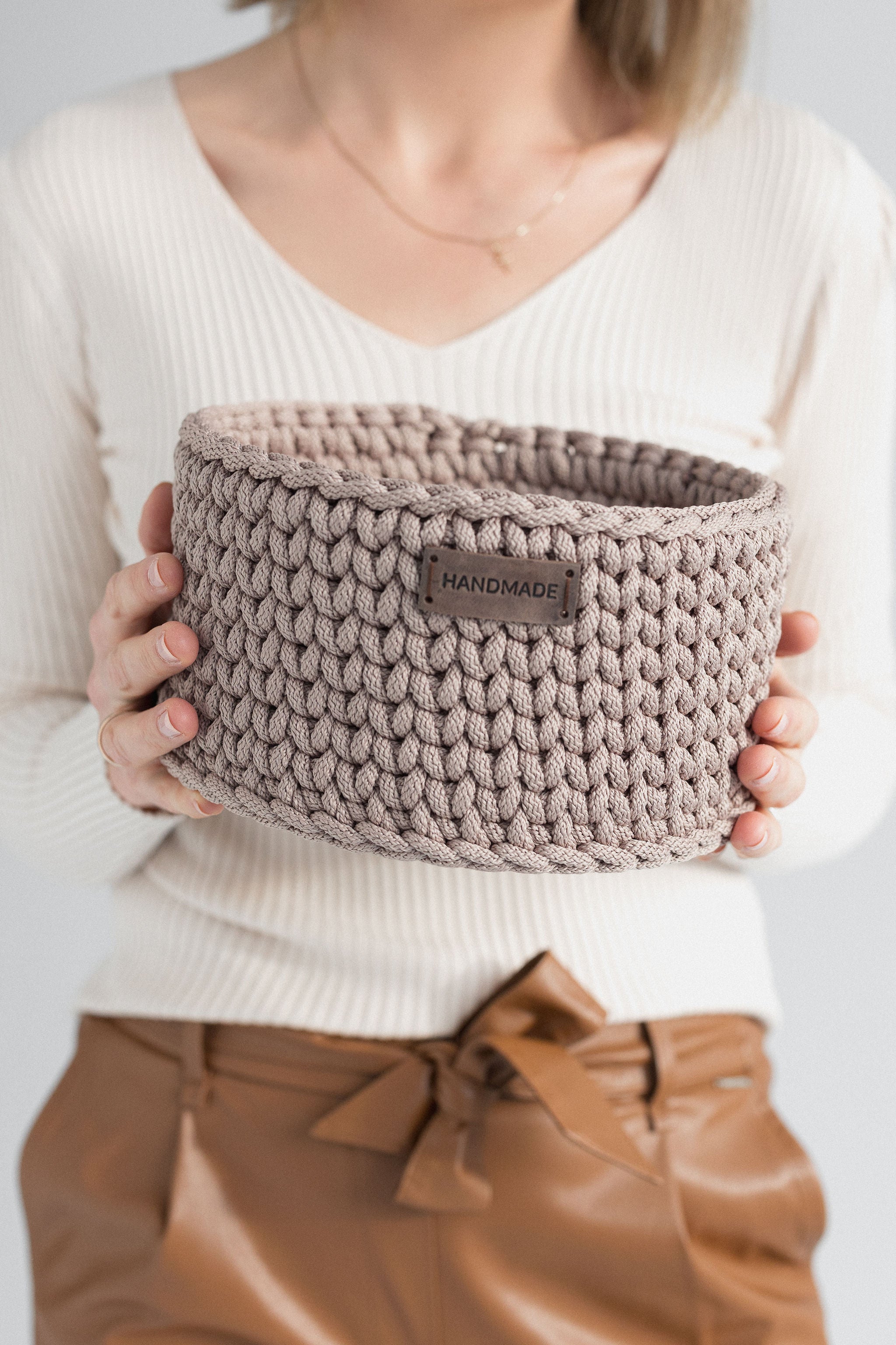 Crochet basket in hands