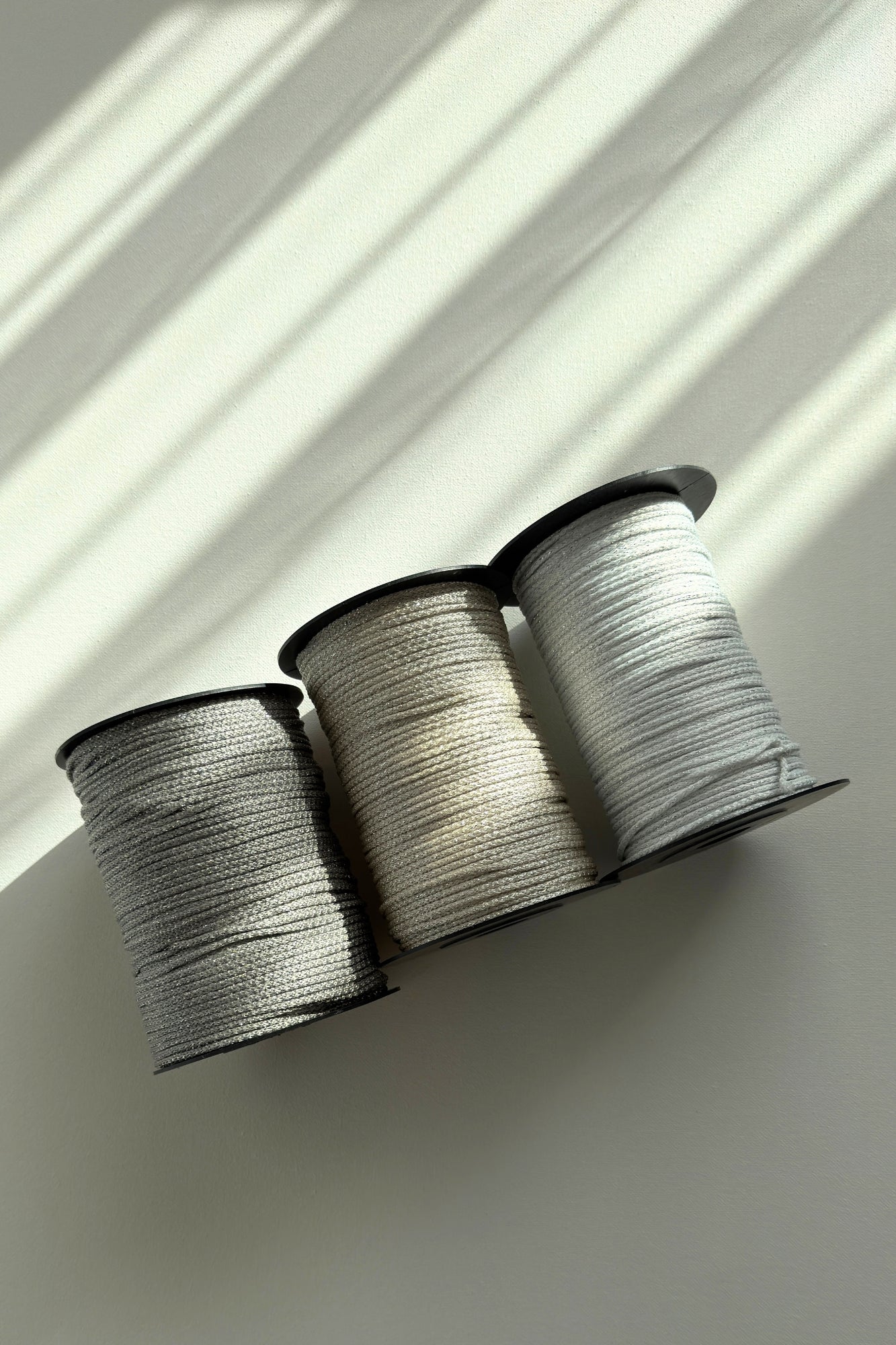 Silver shimmer detail in 3mm polyester macrame cord in the sun
