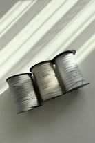 Silver shimmer detail in 3mm polyester macrame cord in the sun