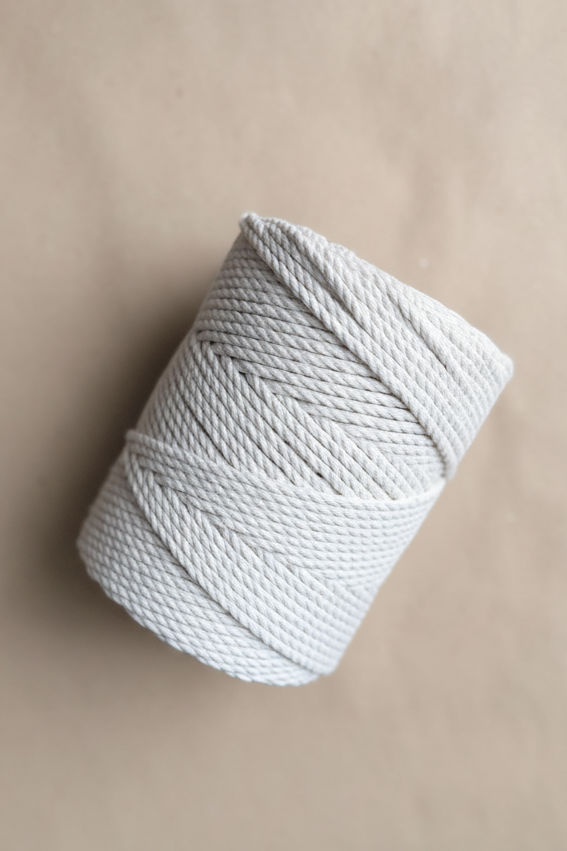 Close-up of 4mm macrame cord showing soft 3-ply twisted cotton texture