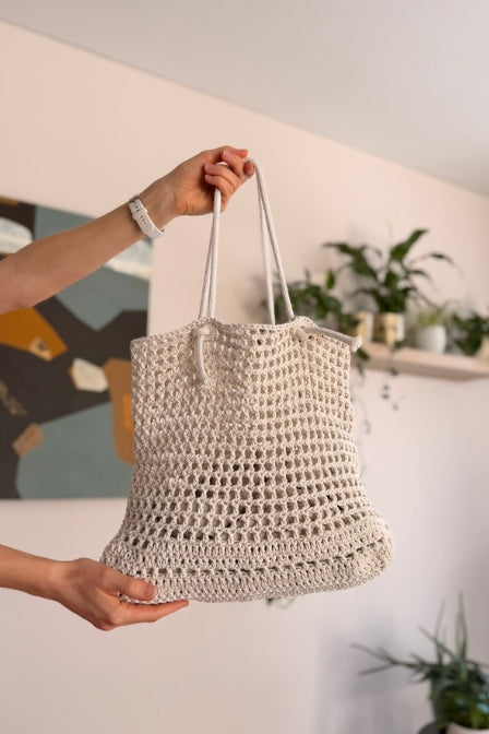 Woman carrying handmade August bag from beginner pattern