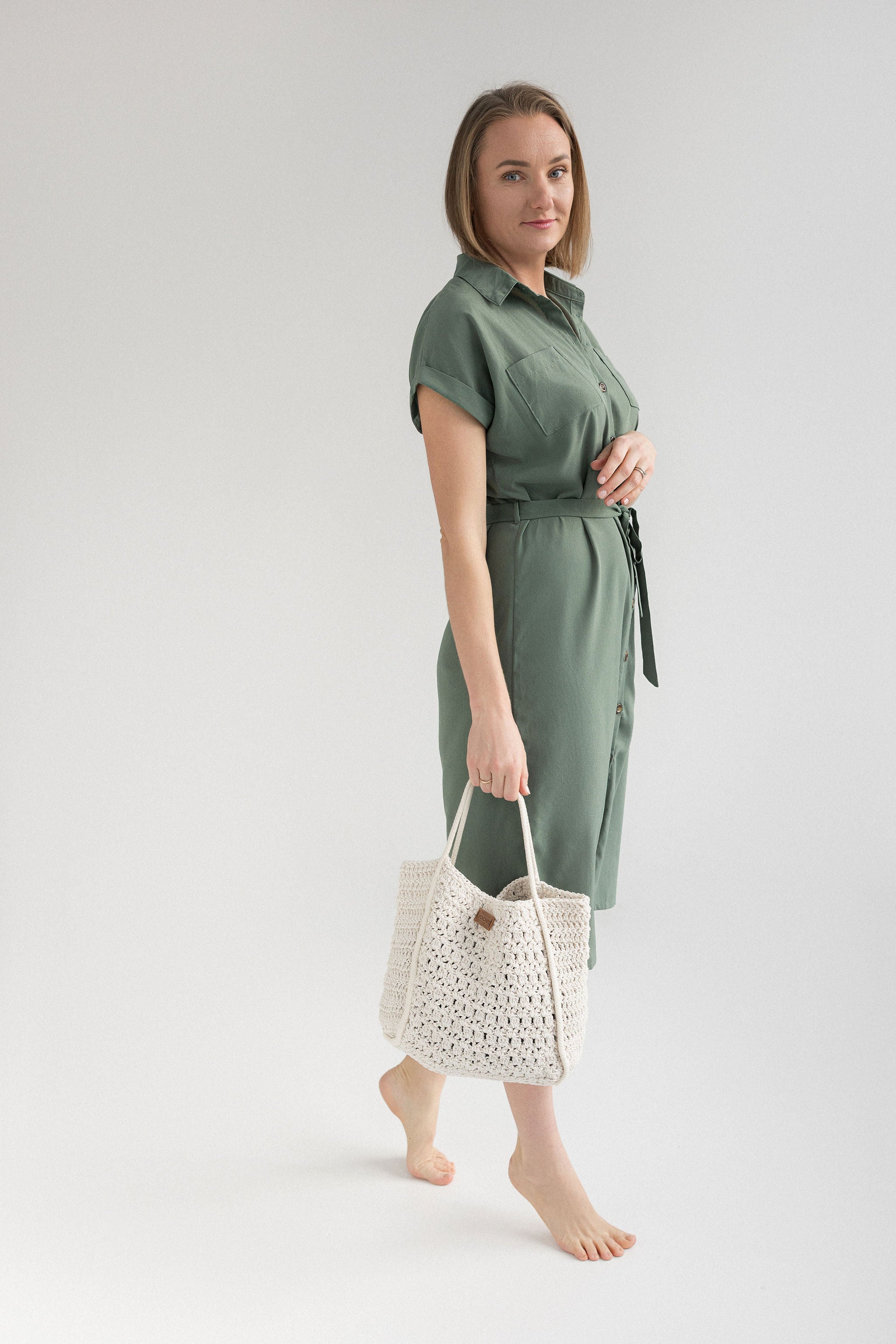 Crochet summer bag holding in hands