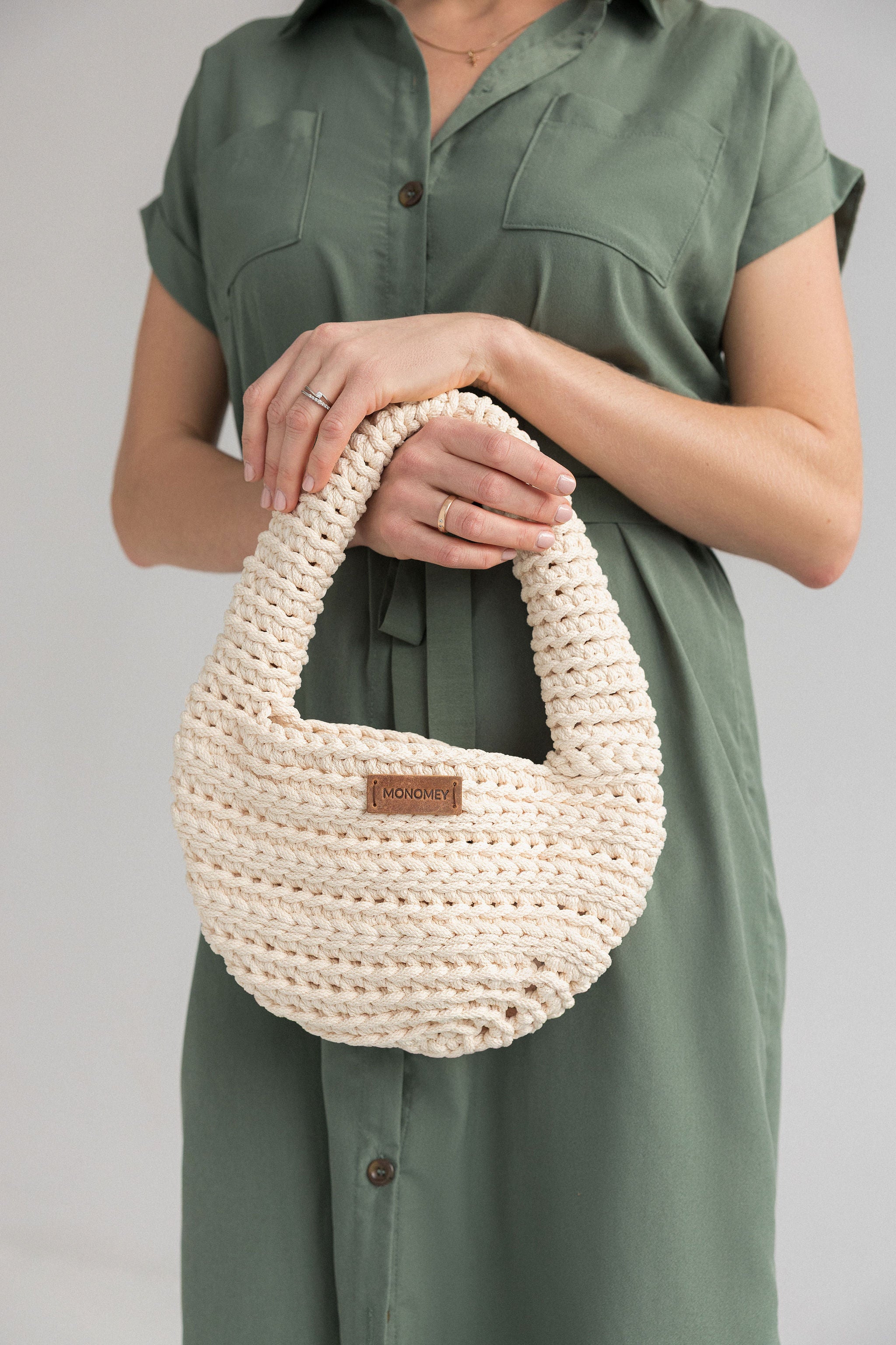 Handmade ivory crochet halfmoon bag in details