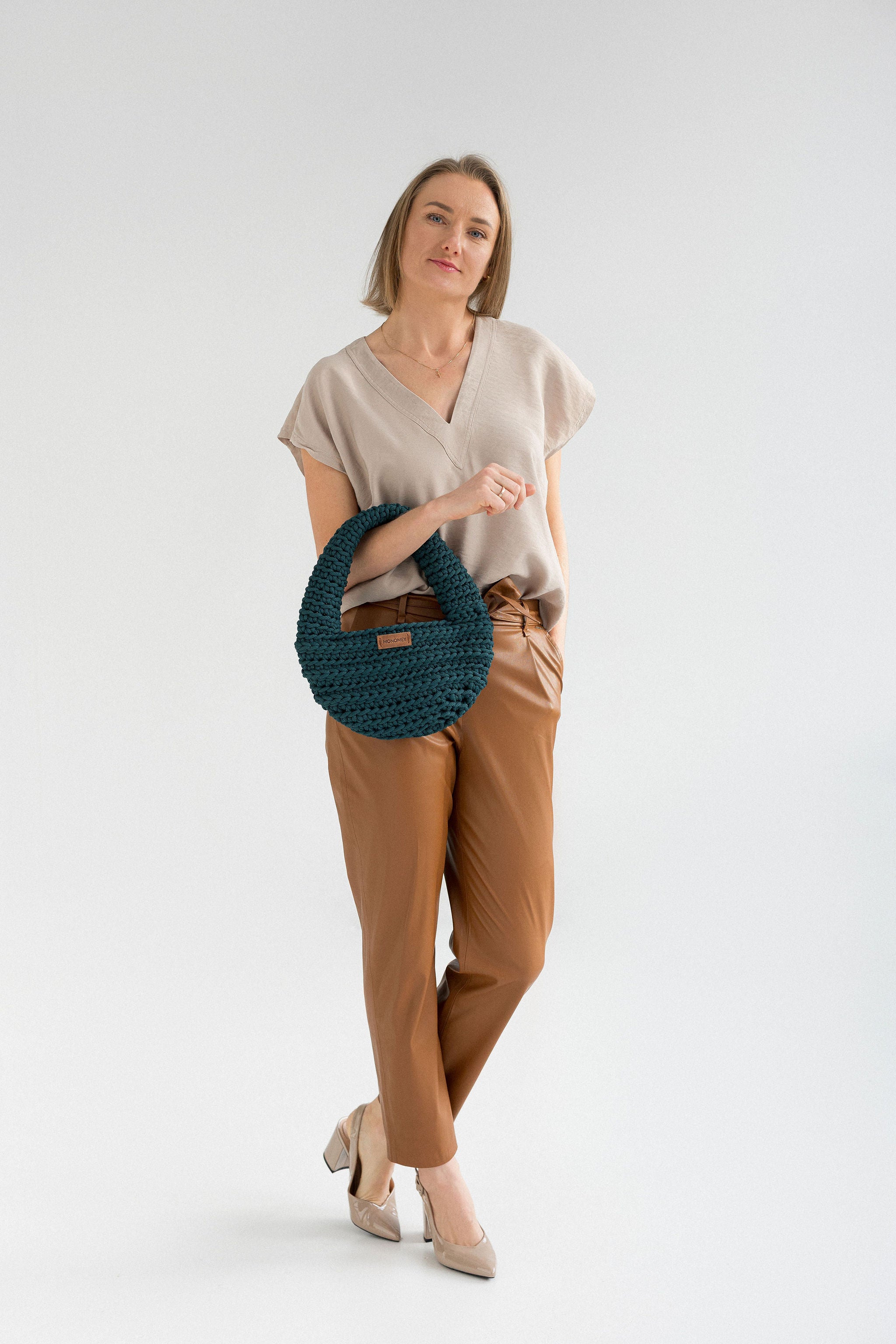 Handmade crochet in style holding in hands